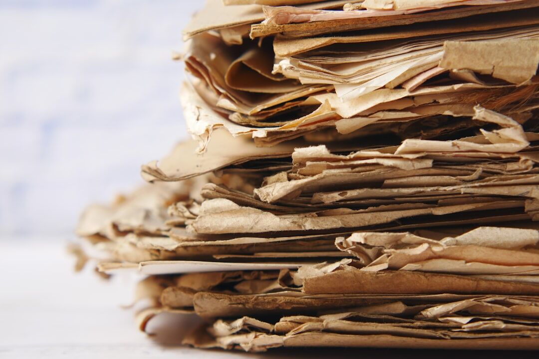 Stack of old handwritten letters and documents tied with string
